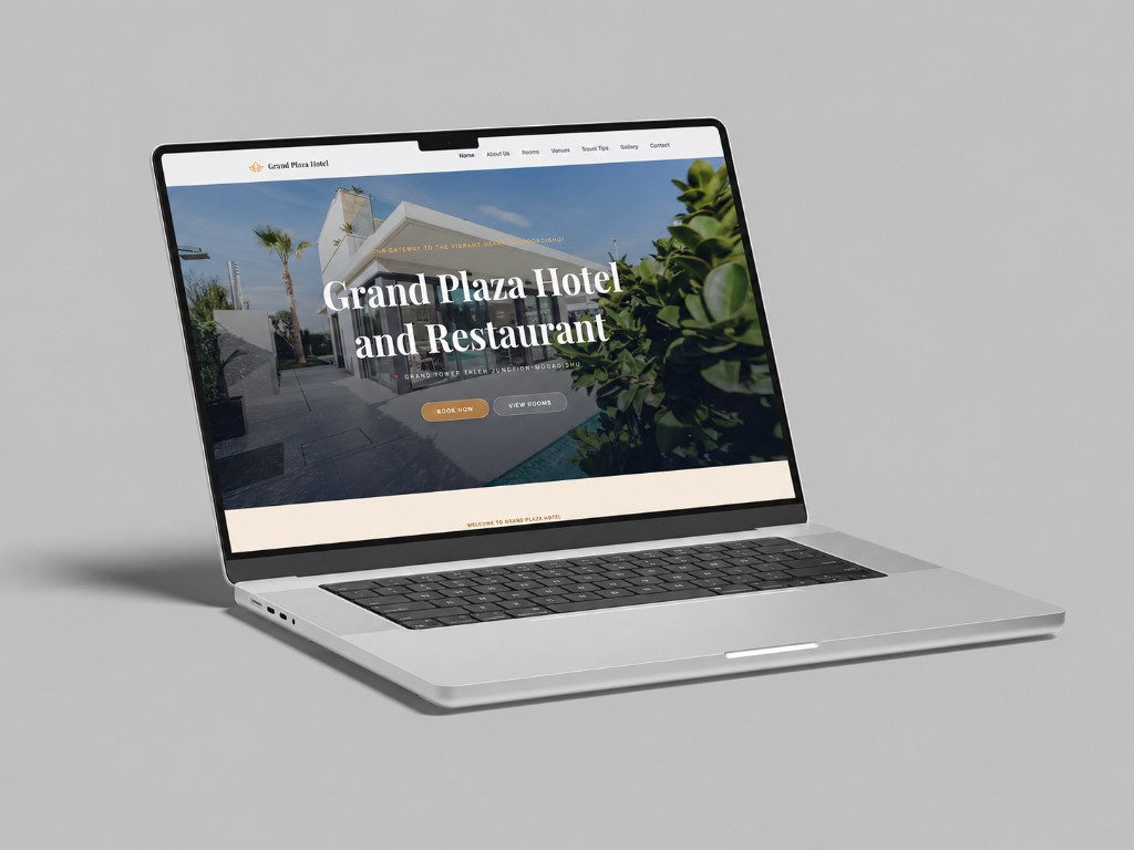 Grand Plaza Hotel website shown on a laptop